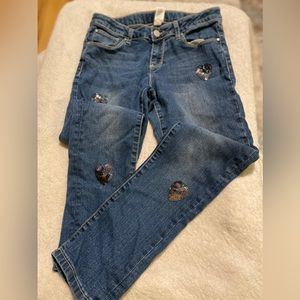 Total Girl size 14 jeans with heart embellishments.